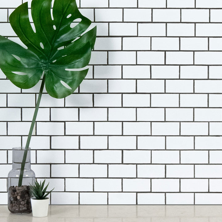 A timeless glossy porcelain mosaic, Domino White 2X4 Porcelain Mosaic features a bright white finish with a reflective surface.