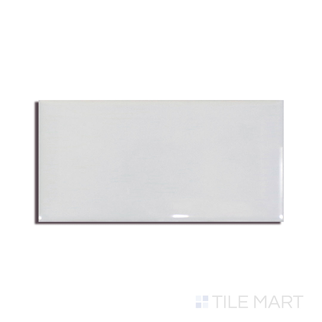 Angled shot of GRAY GLOSSY 3X6 BEVELED PORCELAIN TILE with a GLOSSY finish, revealing the depth of the product with a skewed visual perspective.