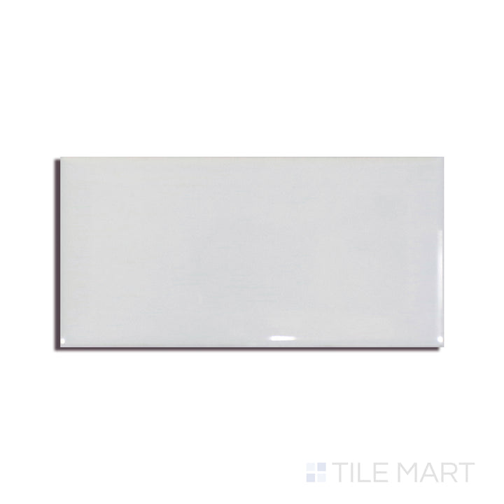 Angled shot of GRAY GLOSSY 3X6 BEVELED PORCELAIN TILE with a GLOSSY finish, revealing the depth of the product with a skewed visual perspective.