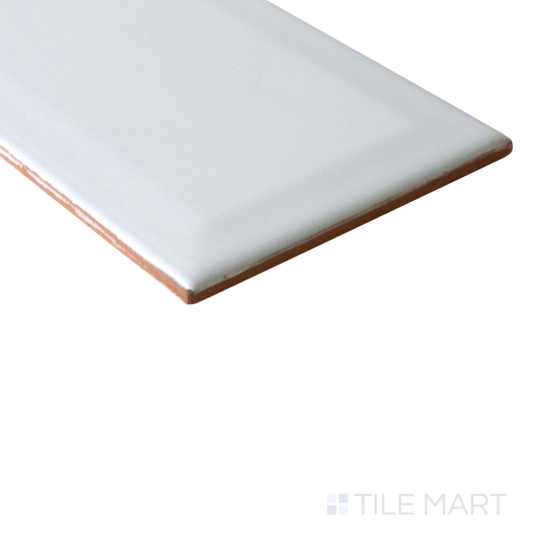 Corner shot of GRAY GLOSSY 3X6 BEVELED PORCELAIN TILE with a GLOSSY finish, displaying the product's strong structure and nuanced texture from the corner.