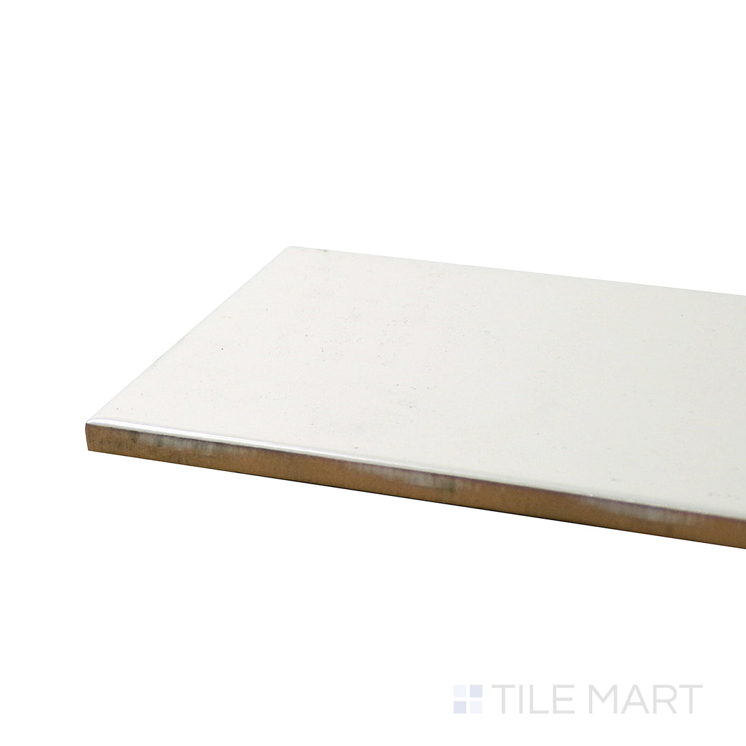 Corner shot of ALMOND GLOSSY 4X16 BULLNOSE PORCELAIN TILE with a GLOSSY finish, revealing the intricate edge detailing and thickness from a corner viewpoint.