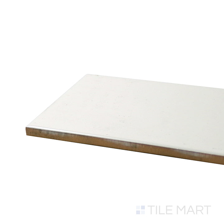 Corner shot of ALMOND GLOSSY 4X16 BULLNOSE PORCELAIN TILE with a GLOSSY finish, revealing the intricate edge detailing and thickness from a corner viewpoint.