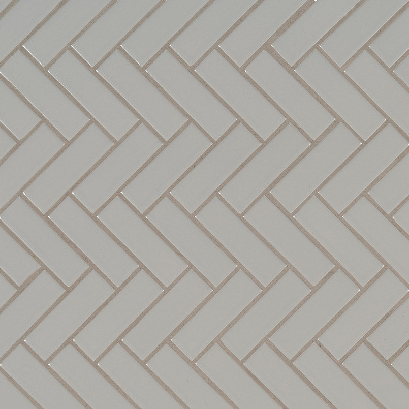Top-down view of GRAY GLOSSY HERRINGBONE 6MM in PORCELAIN MOSAIC with a GLOSSY finish, showcasing the GRAY tones and intricate surface pattern.