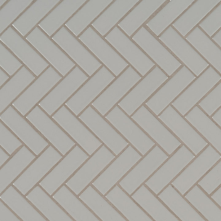 Top-down view of GRAY GLOSSY HERRINGBONE 6MM in PORCELAIN MOSAIC with a GLOSSY finish, showcasing the GRAY tones and intricate surface pattern.