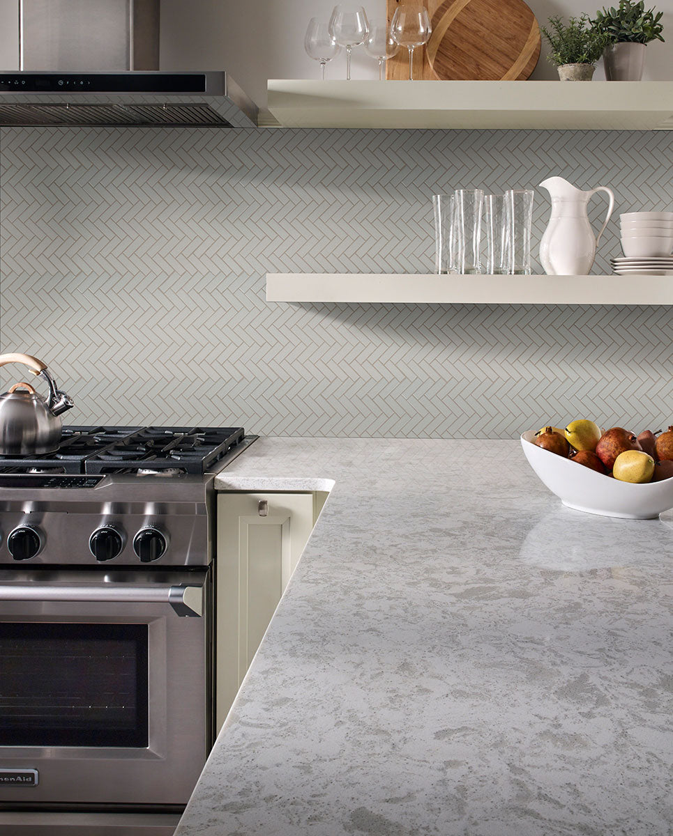 Emphasizing the beauty of GRAY GLOSSY HERRINGBONE 6MM PORCELAIN MOSAIC with a GLOSSY finish, providing a durable yet stylish look to the interior.