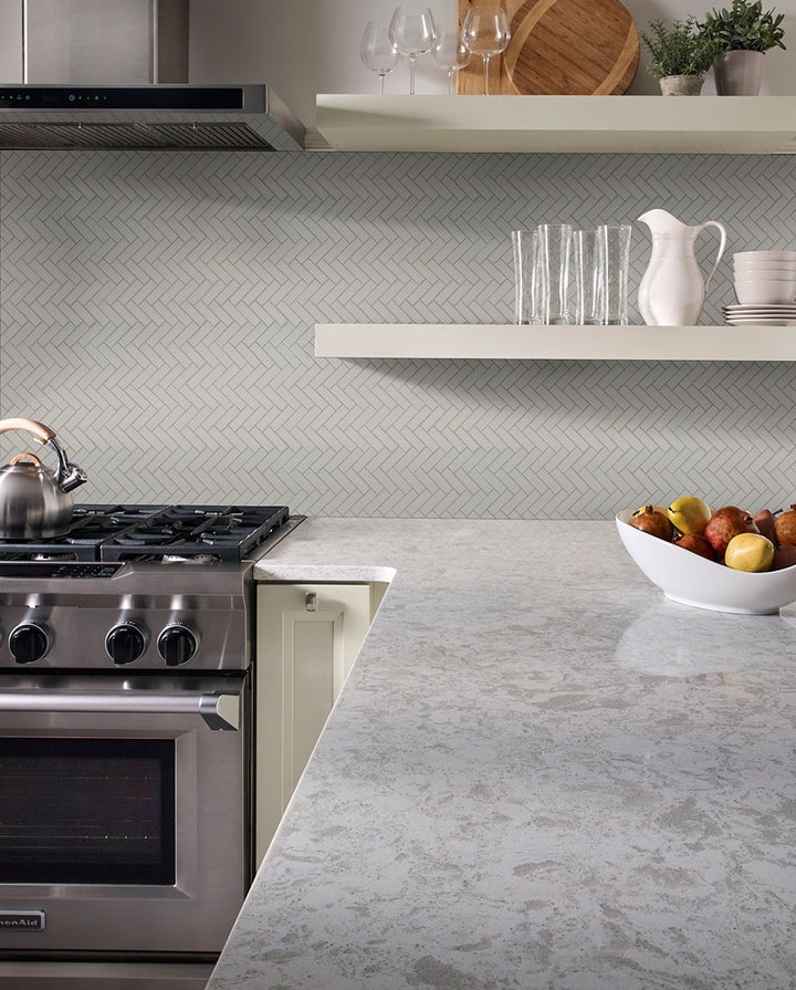 Emphasizing the beauty of GRAY GLOSSY HERRINGBONE 6MM PORCELAIN MOSAIC with a GLOSSY finish, providing a durable yet stylish look to the interior.