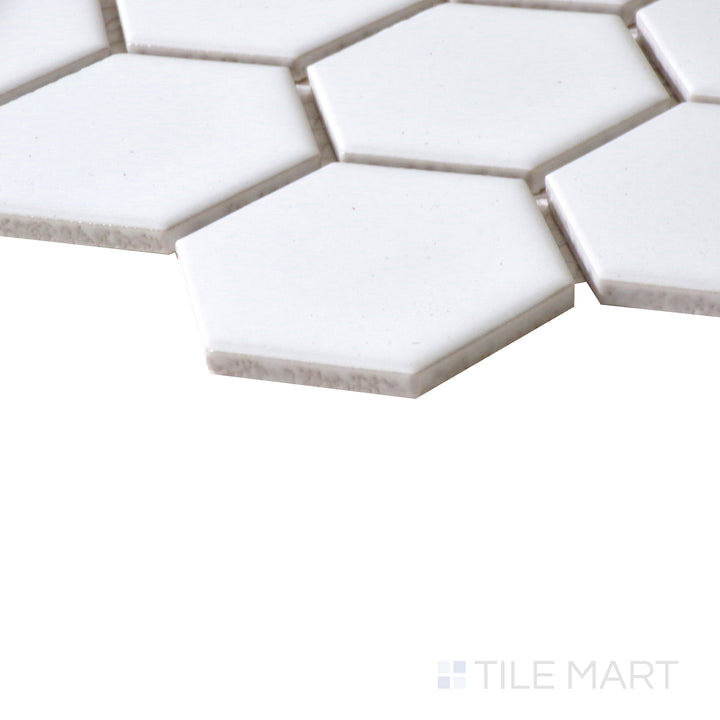 Corner shot of WHITE GLOSSY 2" HEX 6MM PORCELAIN MOSAIC with a GLOSSY finish, offering a close-up look at the product's durability and material thickness at the corner.