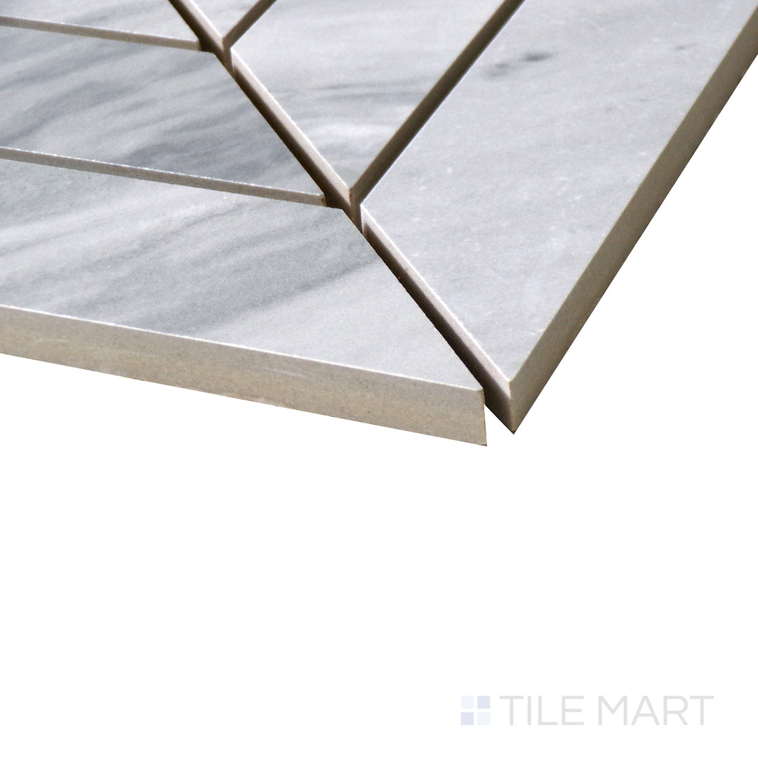 Corner shot of EDEN BARDIGLIO CHEVRON 12X15 MOSAIC PORCELAIN MOSAIC with a MATTE finish, capturing the thickness and material depth from an angled corner perspective.