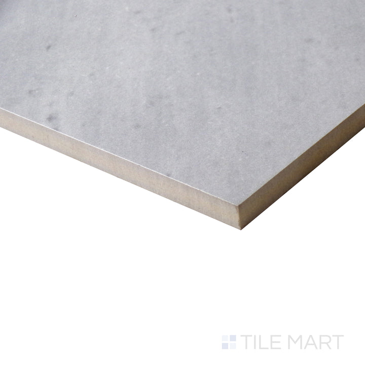 Corner shot of EDEN BARDIGLIO 12X24 POLISHED PORCELAIN TILE with a POLISHED finish, demonstrating the sturdy material and its subtle layering at the corner.