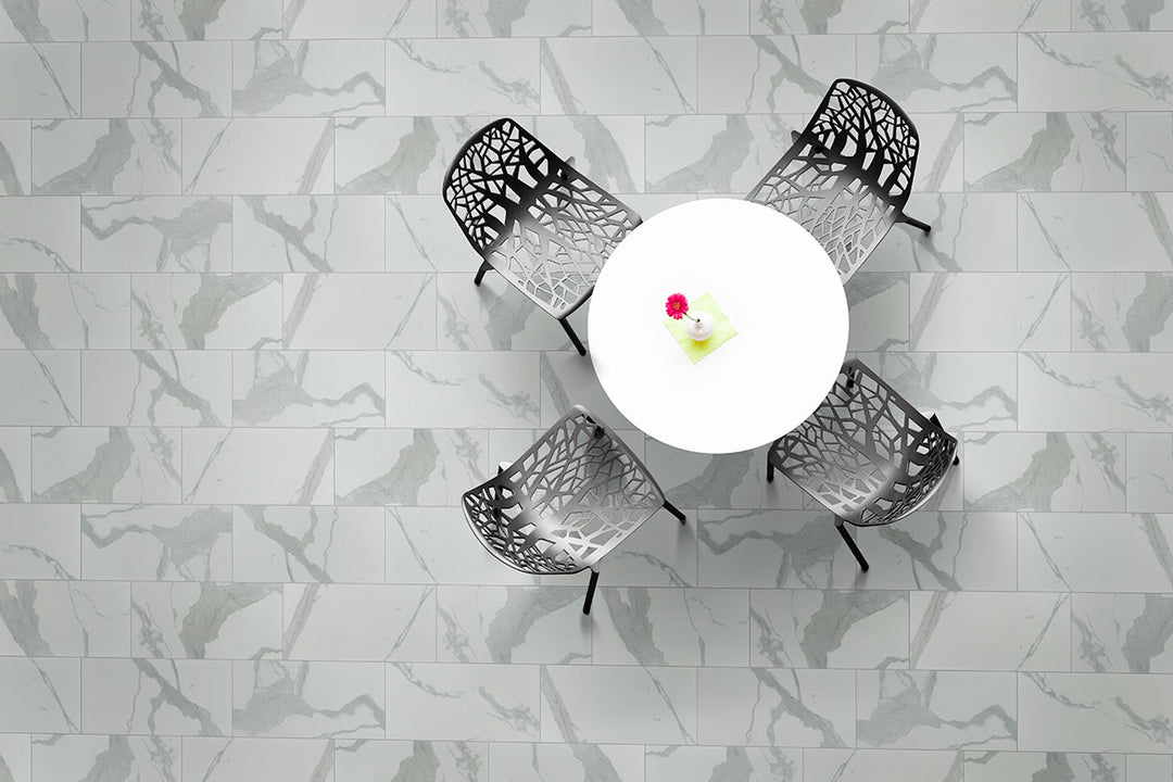 A polished surface reflects light beautifully, highlighting intricate veining and adding a touch of luxury with Eden Statuary 12x24 polished porcelain.