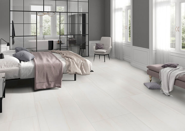 A luminous and polished porcelain tile, Eden Dolomite 24X48 Polished Porcelain offers a white marble-inspired look with intricate gray veining.