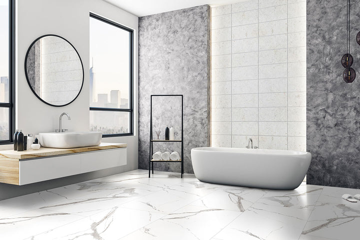 A luxurious and polished porcelain tile, Eden Statuary 24X48 Polished Porcelain features a bright white surface with intricate gray veining.