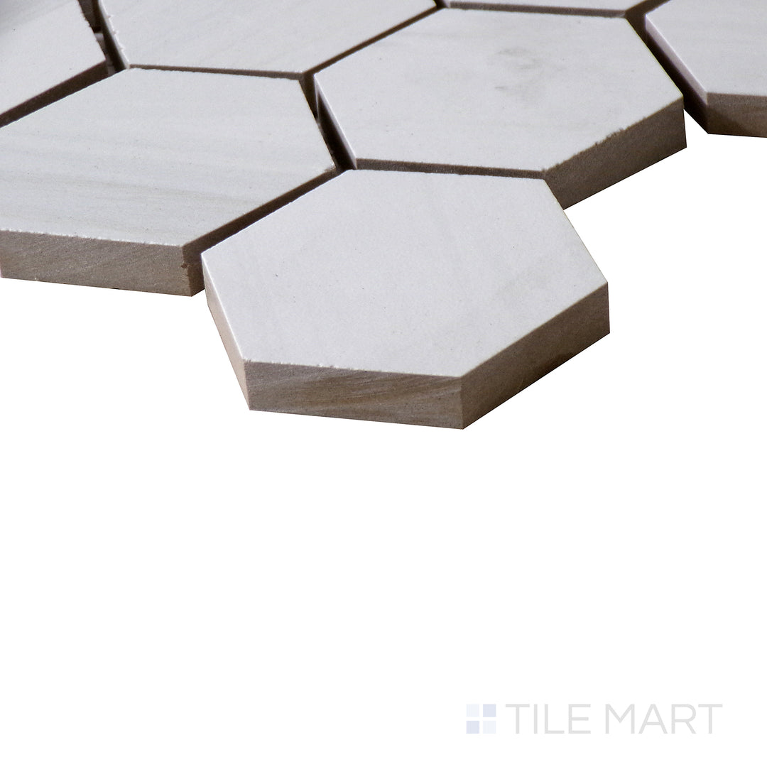 Corner shot of EDEN DOLOMITE 2X2 HEXAGON PORCELAIN MOSAIC with a MATTE finish, showing the robust material and finely finished edge through a focused corner view.