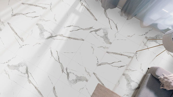 A polished sheen enhances the intricate veining, creating an airy and luxurious effect with Eden Statuary 32x32 polished porcelain.
