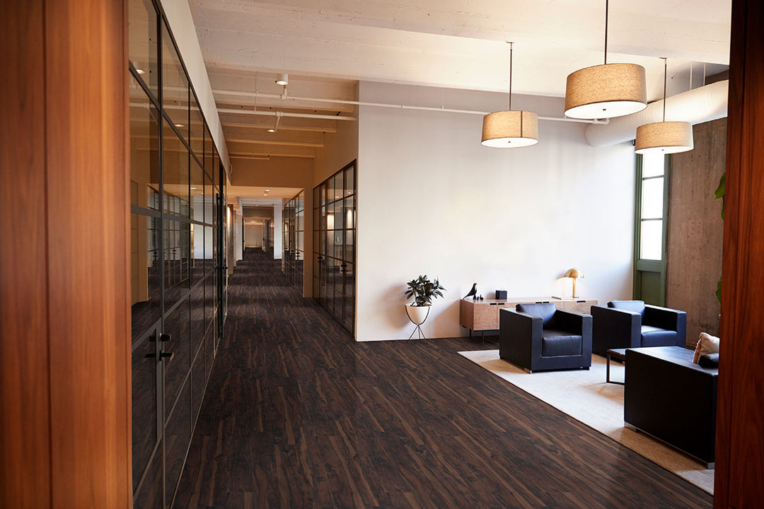 Warm living area featuring Glenridge Burnished Acacia 6X48 flooring, adding rich texture and tone.