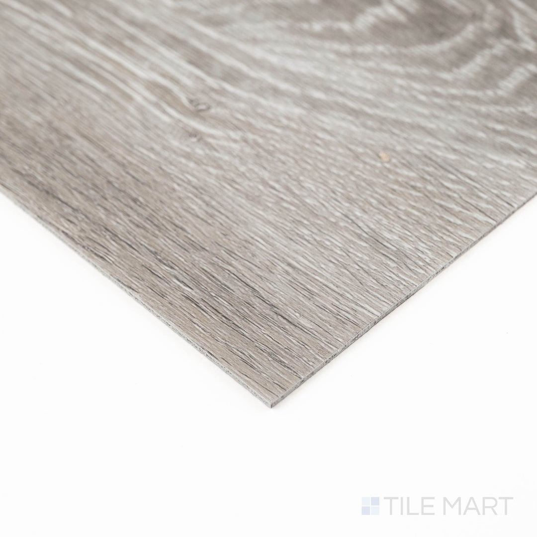 Product corner shot of Glenridge Elmwood Ash 6X48 Low Gloss Luxury Vinyl Plank, emphasizing realistic wood grain and matte finish.