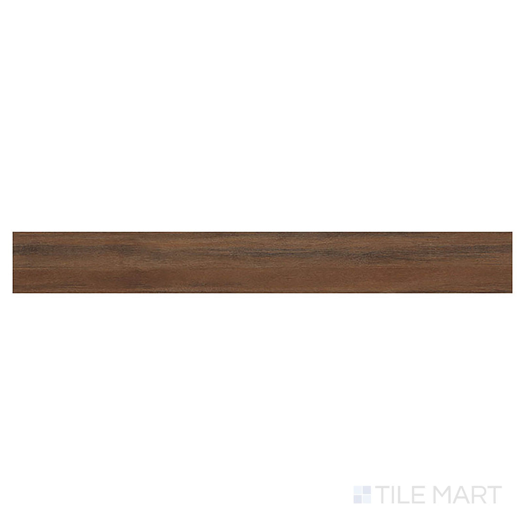 A bird’s-eye view of Glenridge Jatoba 6x48 low gloss luxury vinyl plank shows rich, exotic brown hues and flowing wood patterns.