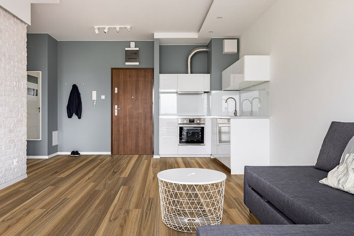 Inviting room scene with Glenridge Tawny Birch 6x48 low gloss luxury vinyl planks, presenting soft beige-brown hues and subtle grain details for a bright, airy atmosphere.