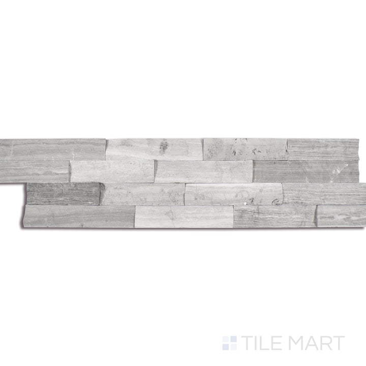 Angled shot of GRAY OAK 3D HONED 6x24 PANEL  MARBLE PANEL with a HONED finish, offering a detailed look at the material's finish with a tilted viewpoint.