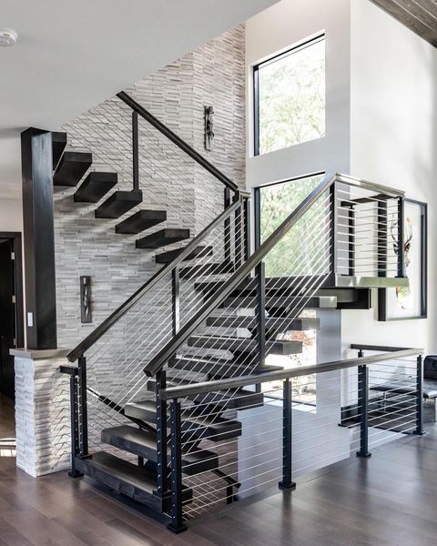 A natural blend of gray tones and honed textures brings a sophisticated, organic feel to the space with Rockmount Gray Oak 6x24 stacked stone panel honed marble.