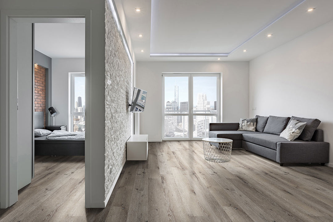 Sleek design brought to life with Katavia Charcoal Oak 6X48 flooring, creating bold visual impact.