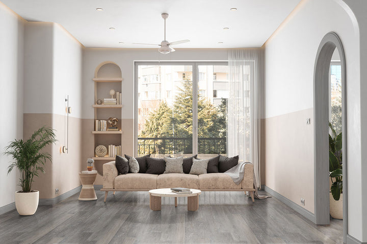 Transitional living space with Katavia Elmwood Ash 6x48 low gloss vinyl plank flooring, showcasing neutral gray-brown tones and refined wood textures for a balanced, versatile design.
