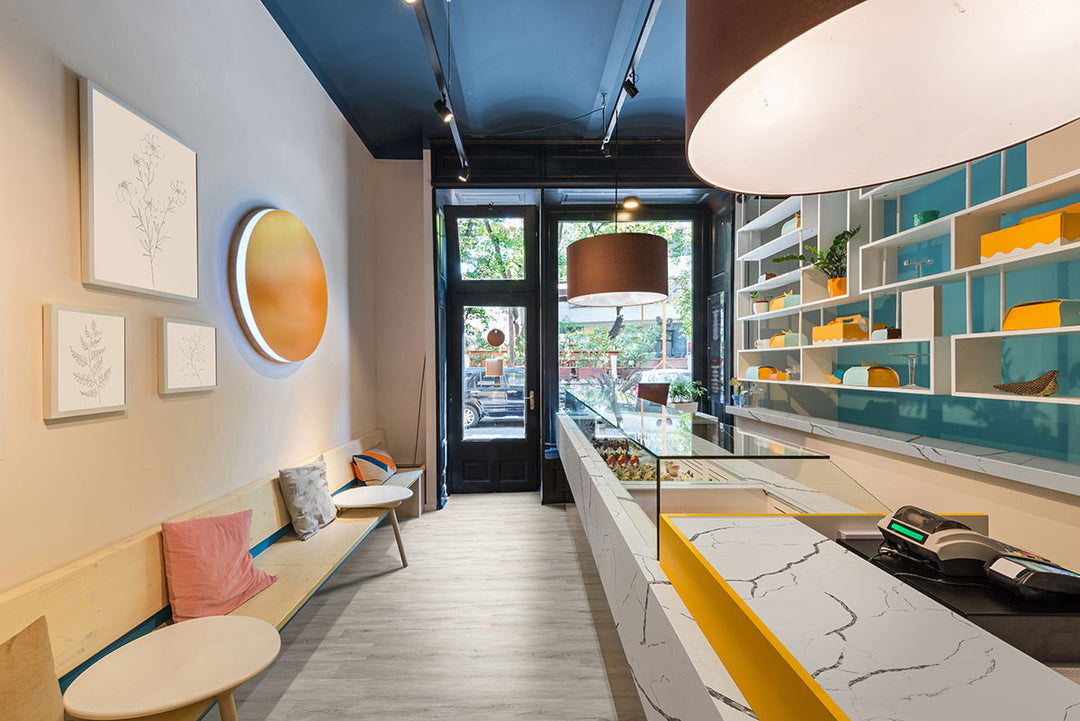 Chic contemporary living space grounded by Katavia Twilight Oak 6x48 vinyl flooring, where moody gray-brown tones create contrast and depth beneath modern furnishings.