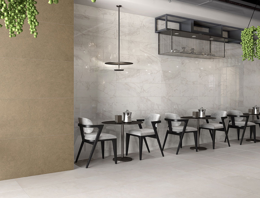 A polished surface enhances the crisp white background and striking veining, elevating interiors with Kaya Calacatta Lucca 12x24 polished porcelain.