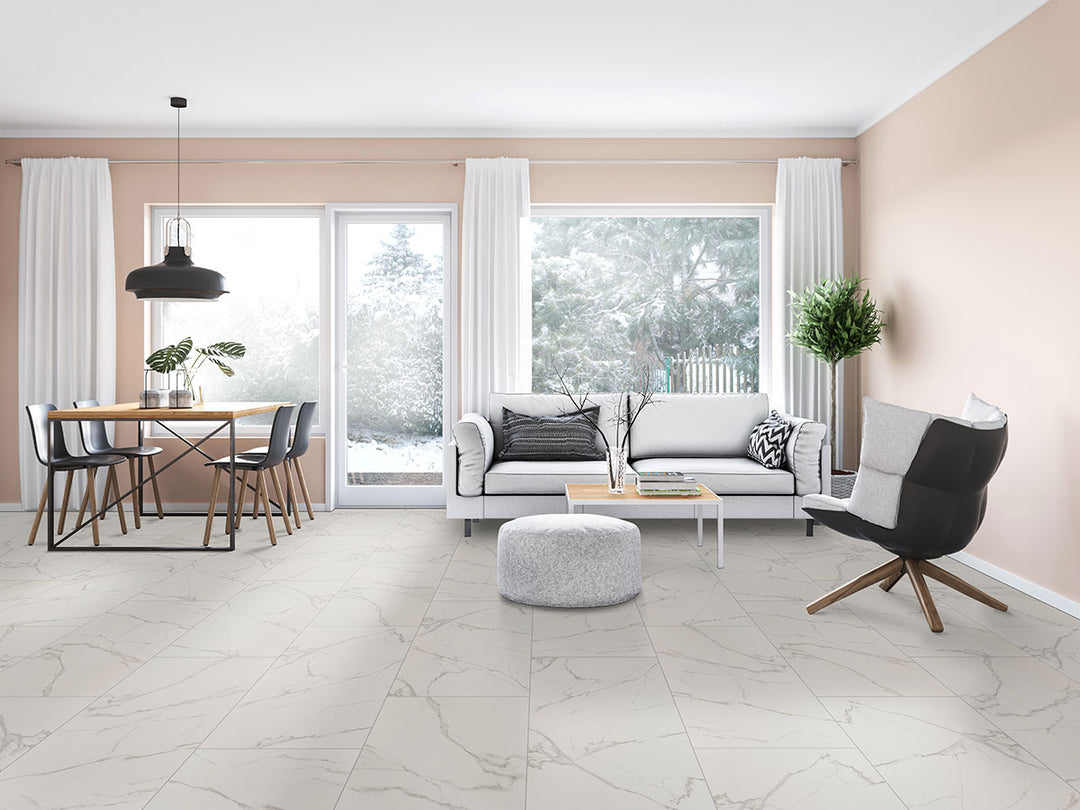 Grand marble aesthetics come to life with Kaya Calacatta Venato 24x48 matte porcelain tiles, featuring distinctive veining.
