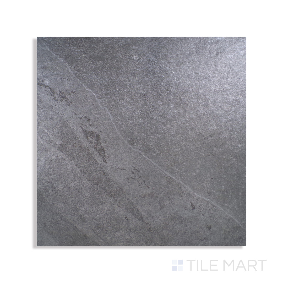Angled shot of LEGIONS MIDNIGHT MONTAGE 24X24 PORCELAIN TILE with a MATTE finish, offering a detailed look at the material's finish with a tilted viewpoint.