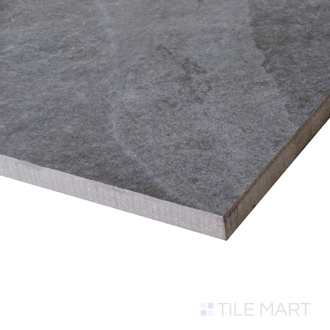 Corner shot of LEGIONS MIDNIGHT MONTAGE 24X24 PORCELAIN TILE with a MATTE finish, offering a close-up look at the product's durability and material thickness at the corner.