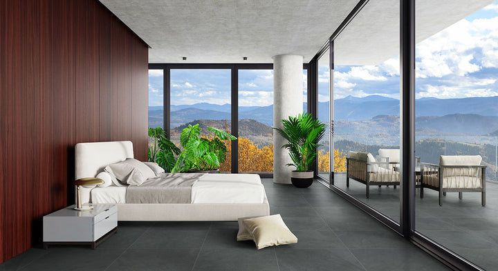 Deep, moody tones and a matte finish define Legion Midnight Montage 24x24 porcelain tiles, adding modern character to any space.