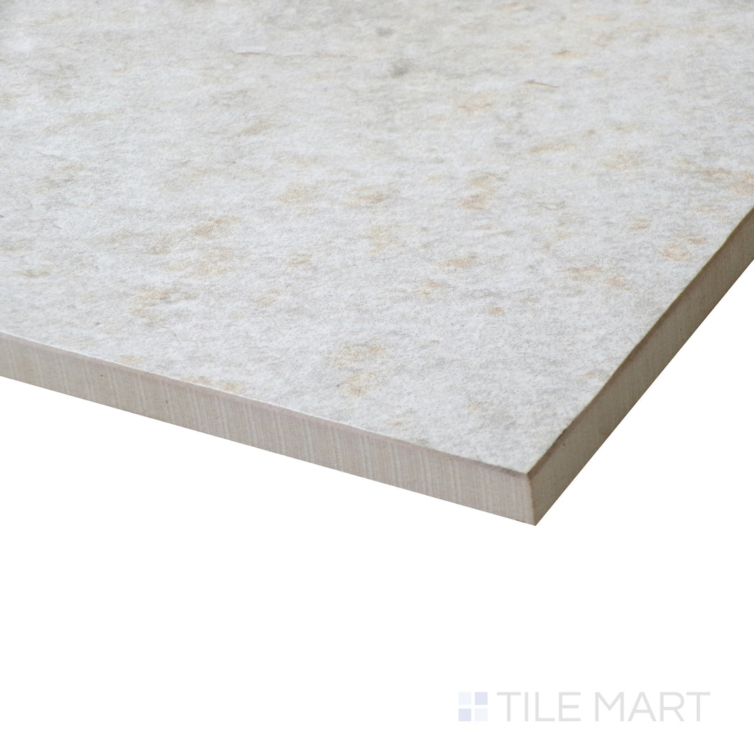 Corner shot of LEGIONS QUARTZ WHITE 24X24 PORCELAIN TILE with a MATTE finish, revealing the intricate edge detailing and thickness from a corner viewpoint.