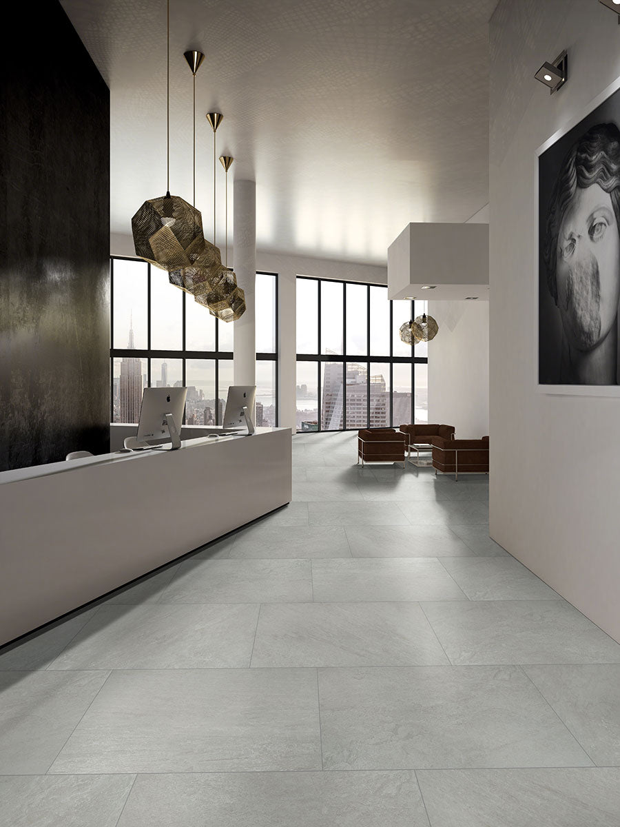 Crisp white tones and a refined matte surface give Legion Quartz White 24x24 porcelain tiles a clean and contemporary feel.