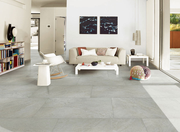 Presenting the stylish aesthetic of LEGIONS QUARTZ WHITE 24X48 PORCELAIN TILE with a MATTE finish, creating a relaxed atmosphere with its serene presence.