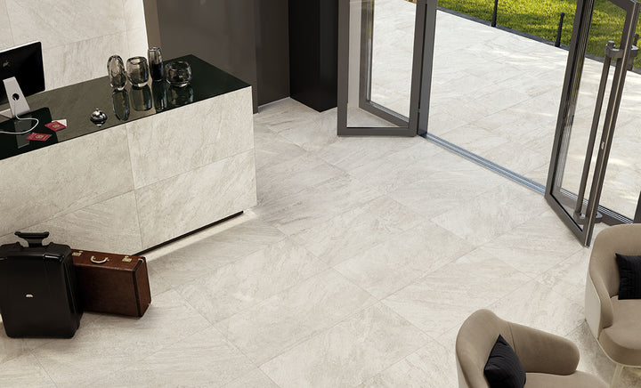 Bright and timeless, Legion Quartz White 24x48 porcelain tiles feature a smooth matte finish that enhances their sleek aesthetic.