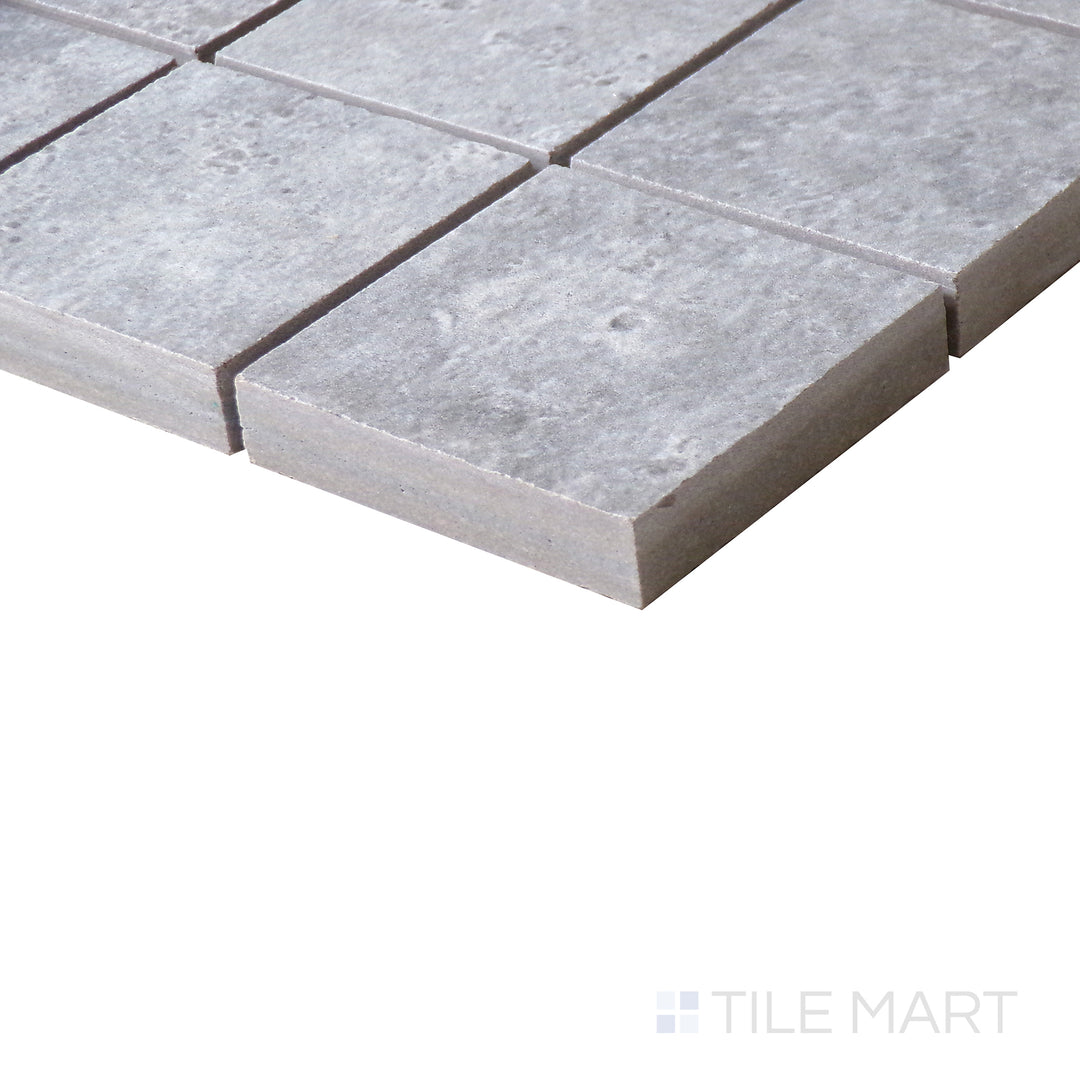 Corner shot of LEGIONS LUNAR SILVER 2X2 MATTE MOSAIC PORCELAIN MOSAIC with a MATTE finish, offering a close-up look at the product's durability and material thickness at the corner.