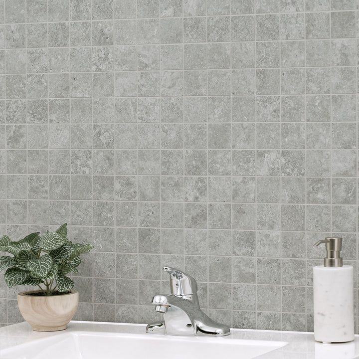 Highlighting the elegance of LEGIONS LUNAR SILVER 2X2 MATTE MOSAIC PORCELAIN MOSAIC with a MATTE finish, blending effortlessly with the surrounding modern elements.