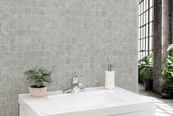 Small yet striking, Legion Lunar Silver 2" square mosaic tiles bring subtle texture and a matte silver-gray finish to the design.
