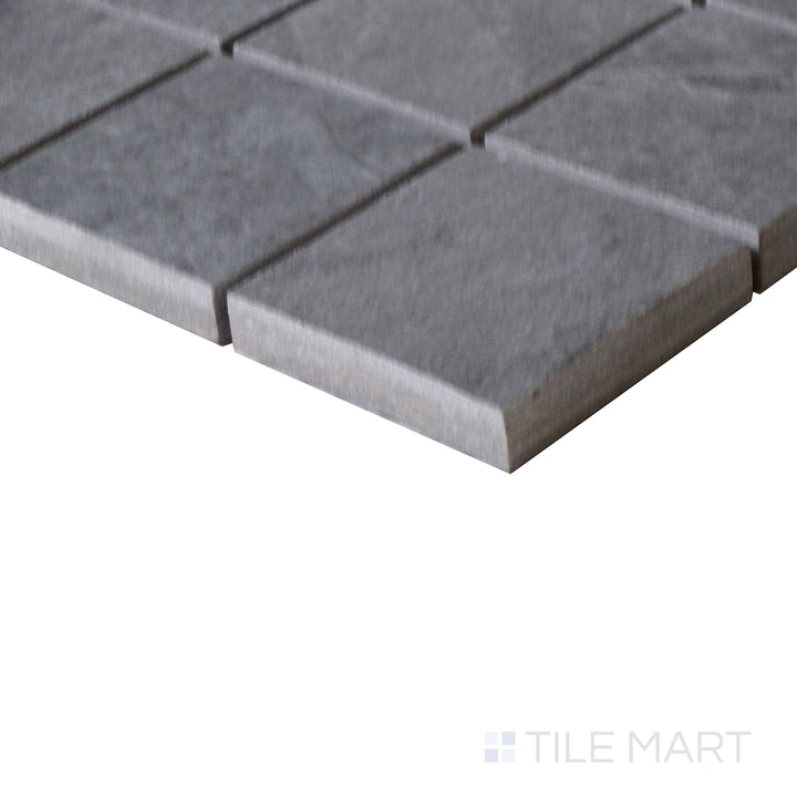 Corner shot of LEGIONS MIDNIGHT MONTAGE 2X2MATTE MOSAIC PORCELAIN MOSAIC with a MATTE finish, capturing the thickness and material depth from an angled corner perspective.