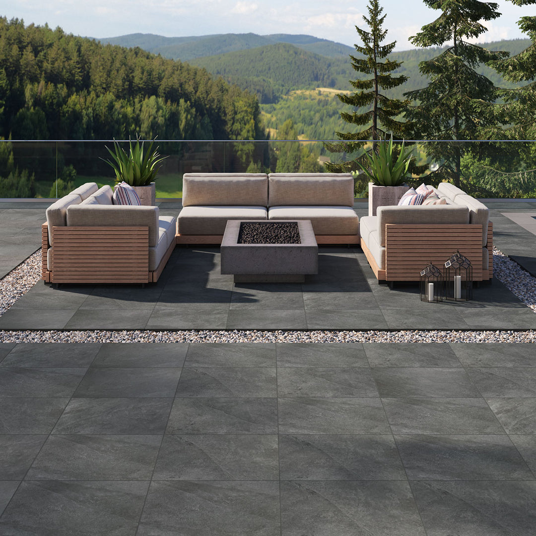 Sleek and modern black pavers elevate the setting, blending effortlessly with Legion Black 24X24 Paver Matte Porcelain.