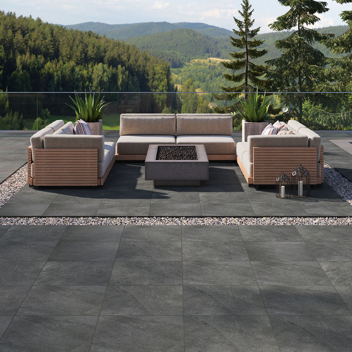 Sleek and modern black pavers elevate the setting, blending effortlessly with Legion Black 24X24 Paver Matte Porcelain.