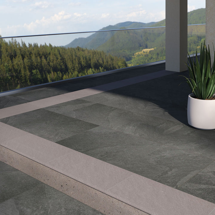 Displaying the refined texture of LEGIONS MONTAUK BLACK 24X48 PAVER PORCELAIN PAVER with a MATTE finish, adding a touch of warmth and texture to the space.