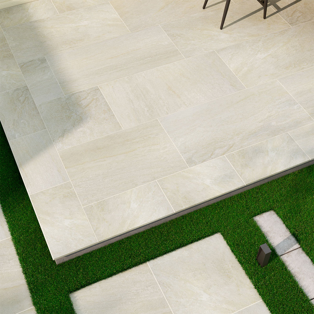 Emphasizing the beauty of LEGIONS QUARTZ WHITE 24X48 PAVER PORCELAIN PAVER with a MATTE finish, creating a relaxed atmosphere with its serene presence.