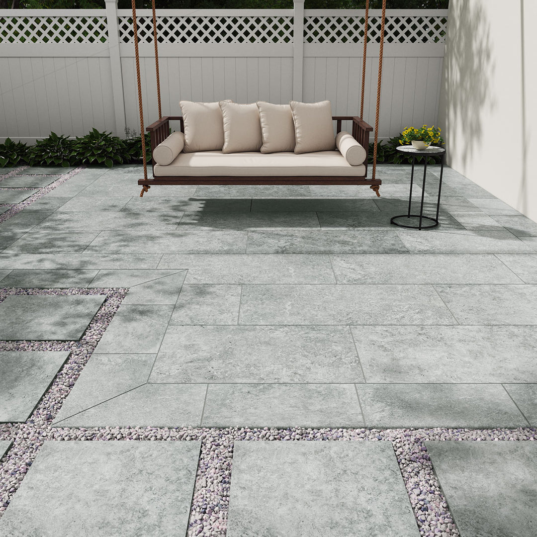 Bringing focus to the sophisticated look of LEGIONS SILVER TRAV 24X48 PAVER PORCELAIN PAVER with a MATTE finish, blending effortlessly with the surrounding modern elements.