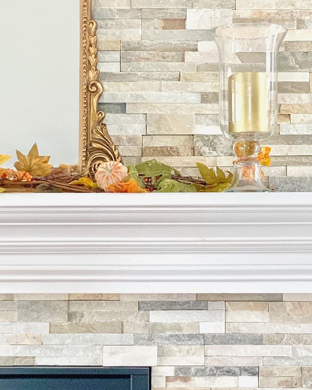 Golden tones and natural texture bring warmth to the space with Rockmount Honey 6x24 stacked stone panels in splitface quartzite.