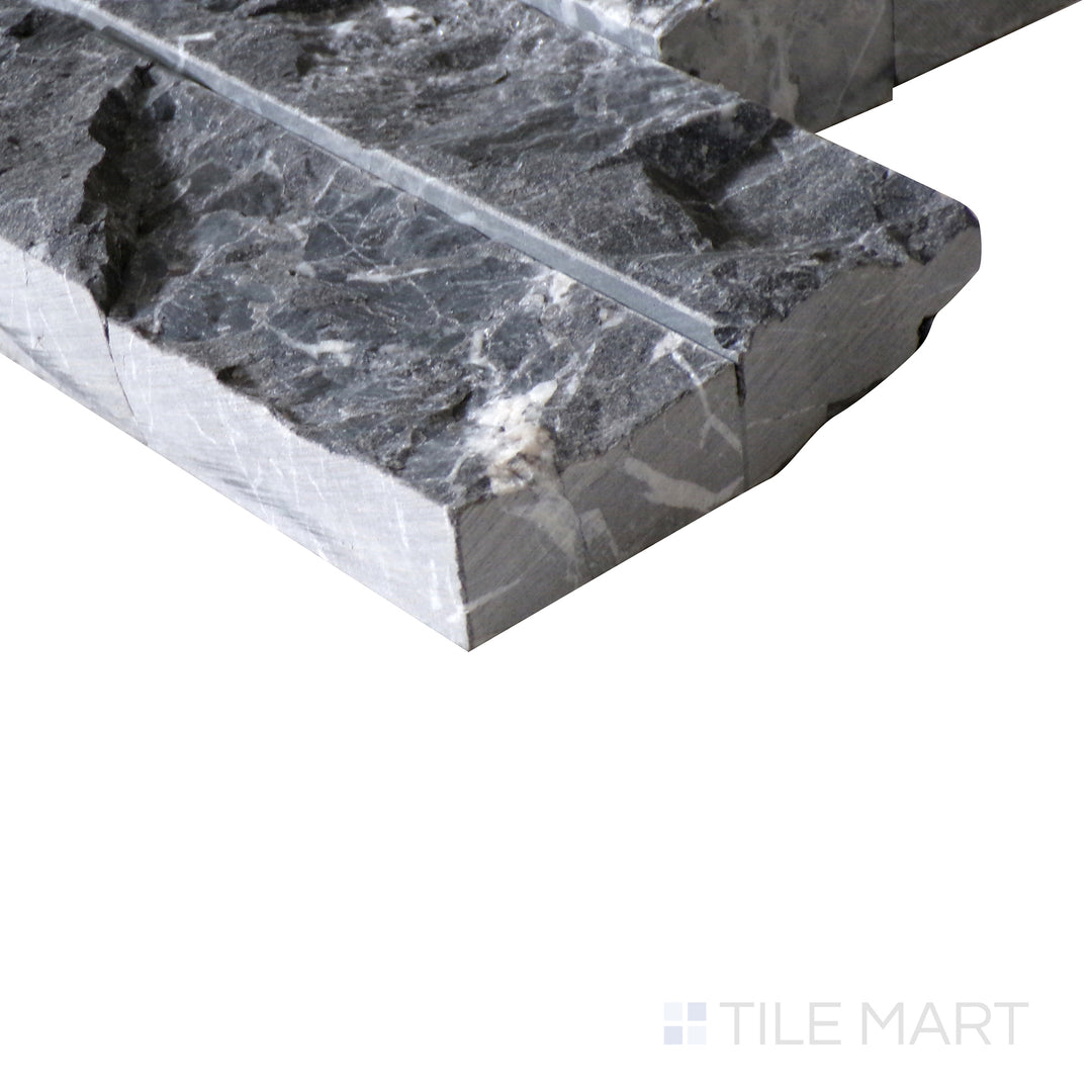 Corner shot of MARQUINA NERO SPLITFACE 6X24 PANEL MARBLE PANEL with a SPLITFACE finish, emphasizing the layered construction and the product's distinct edge design.