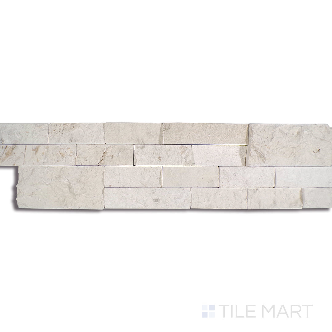 Angled shot of MAYRA WHITE LIMESTONE 6X24 PANEL LIMESTONE PANEL with a SPLITFACE finish, offering a detailed look at the material's finish with a tilted viewpoint.