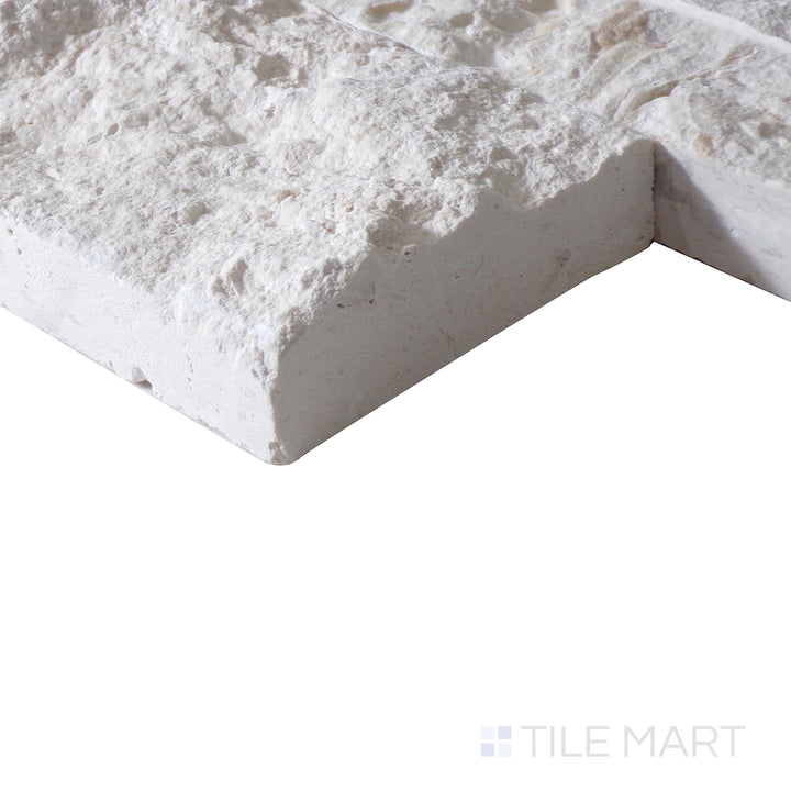 Corner shot of MAYRA WHITE LIMESTONE 6X24 PANEL LIMESTONE PANEL with a SPLITFACE finish, demonstrating the sturdy material and its subtle layering at the corner.