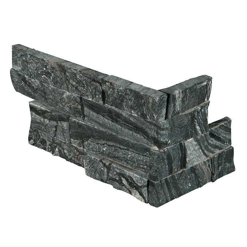 Top-down view of GLACIAL BLACK LEDGER CORNER in MARBLE PANEL with a SPLITFACE finish, emphasizing its surface details and intricate design.